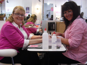 Boobie Beauty Fundraiser guest receives complimentary manicure. Photo: Brooke Schlyer